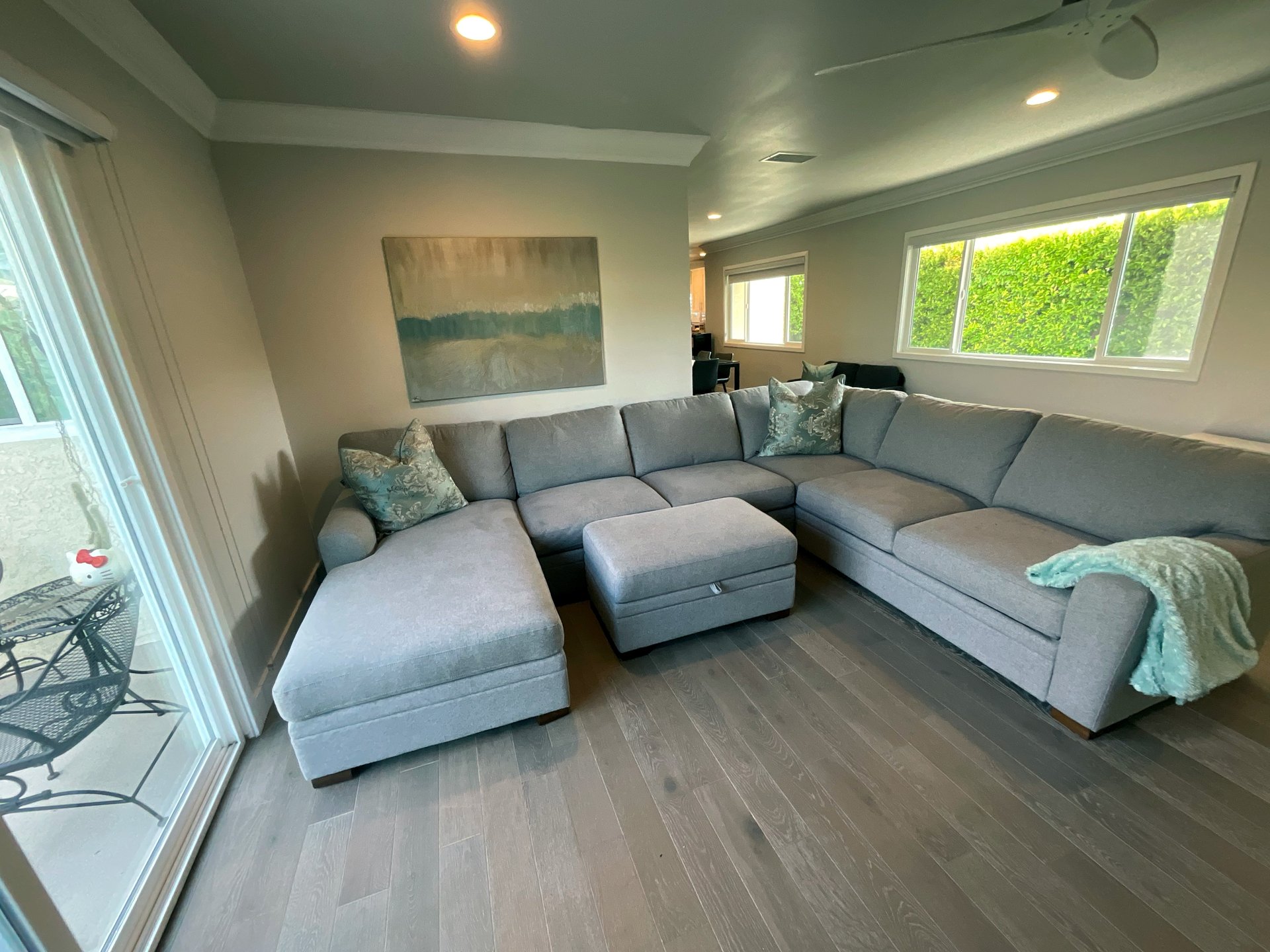 Second living area with sectional and backyard access